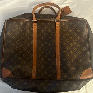 Louis Vuitton Brown Monogram Carry-On Travel Bag with Tan Trim.
